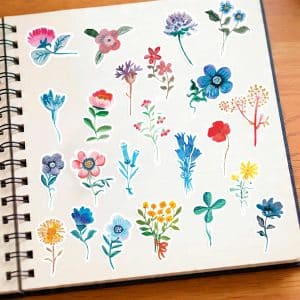 Lot de 46 stickers fleurs illustrées Flower Power, petites fleurs colorées disposées dans un carnet